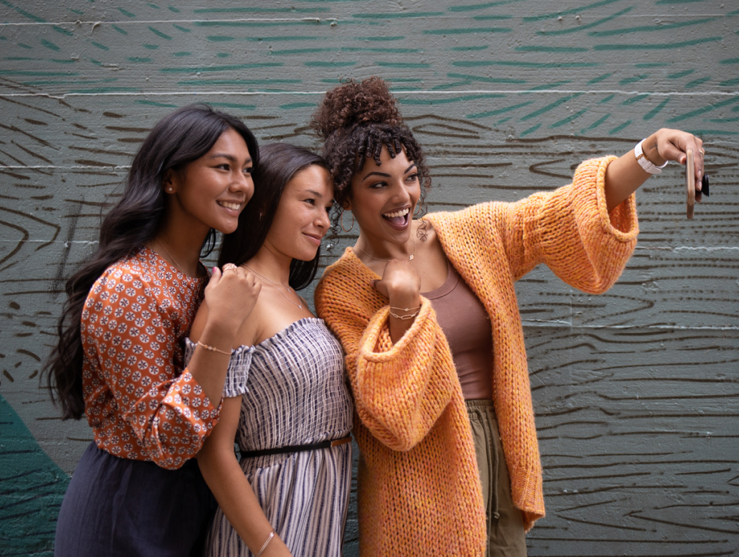 3 smiling women taking a group photo