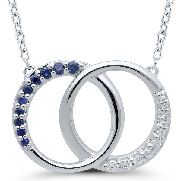 Two circles locked together in a stunning representation of connection and unity. Real diamonds and sapphires