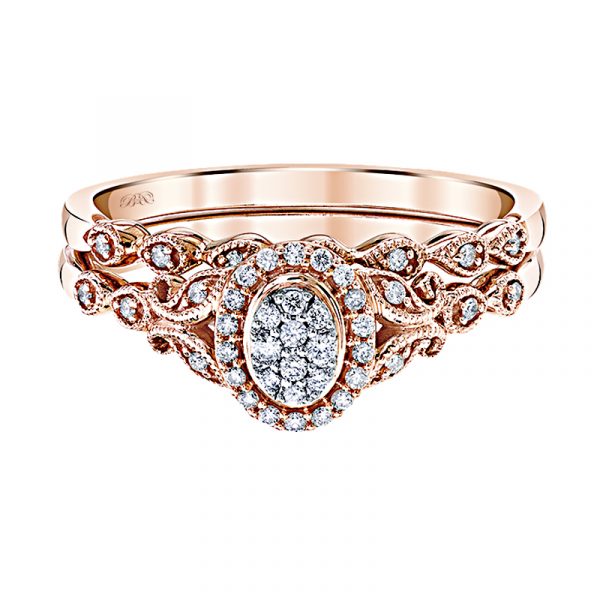 A gorgeous floral wedding set in 10K Rose Gold with diamonds and an oval-shaped cluster of dazzling diamonds in the center, accented by a halo and milgrain!