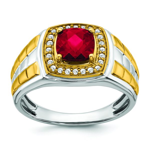 A Cushion-cut Ruby set in Sterling Silver, surrounded by diamonds, and accented by classic Yellow Gold.A Cushion-cut Ruby set in Sterling Silver, surrounded by diamonds, and accented by classic Yellow Gold.