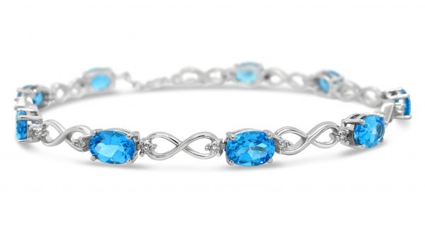Infinity Link Bracelet with Oval Blue Topaz and diamonds