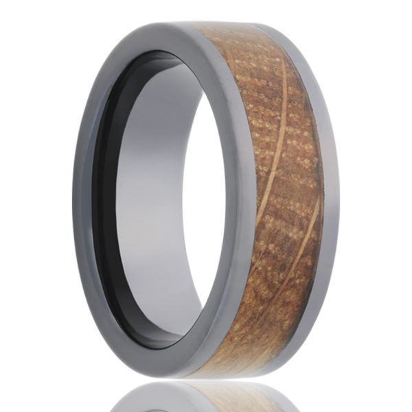 A handsome Black Ceramic band with a wood accent that looks like it was pulled straight from a Southern Whiskey Barrel. 